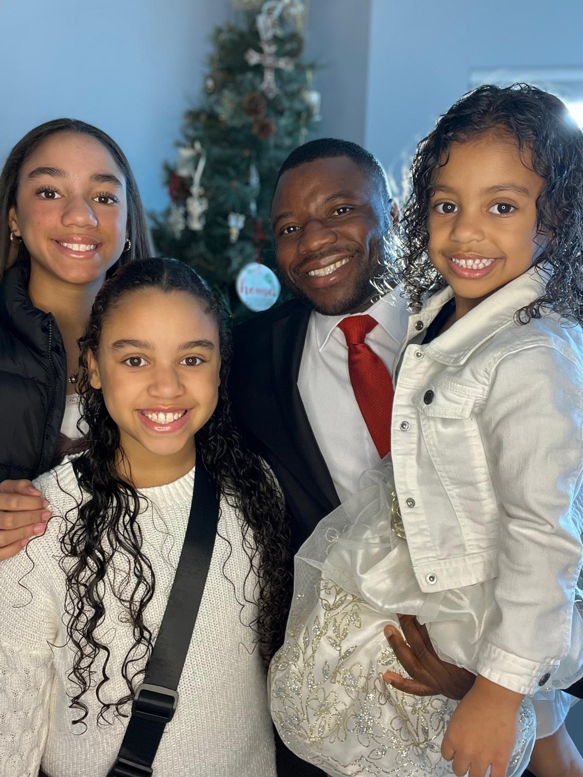Gospel Kordah with his children, founder of Future1 Community
